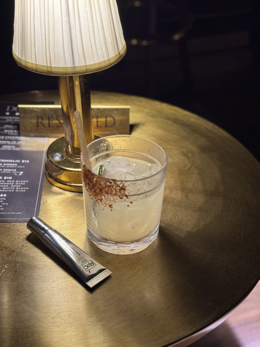 Perfume and jewelry on a tray