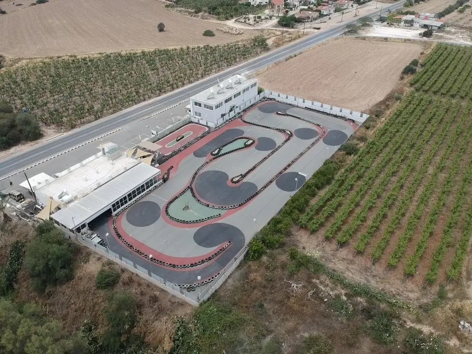 An aerial drone view of the main karting track, showing the full circuit layout from above.