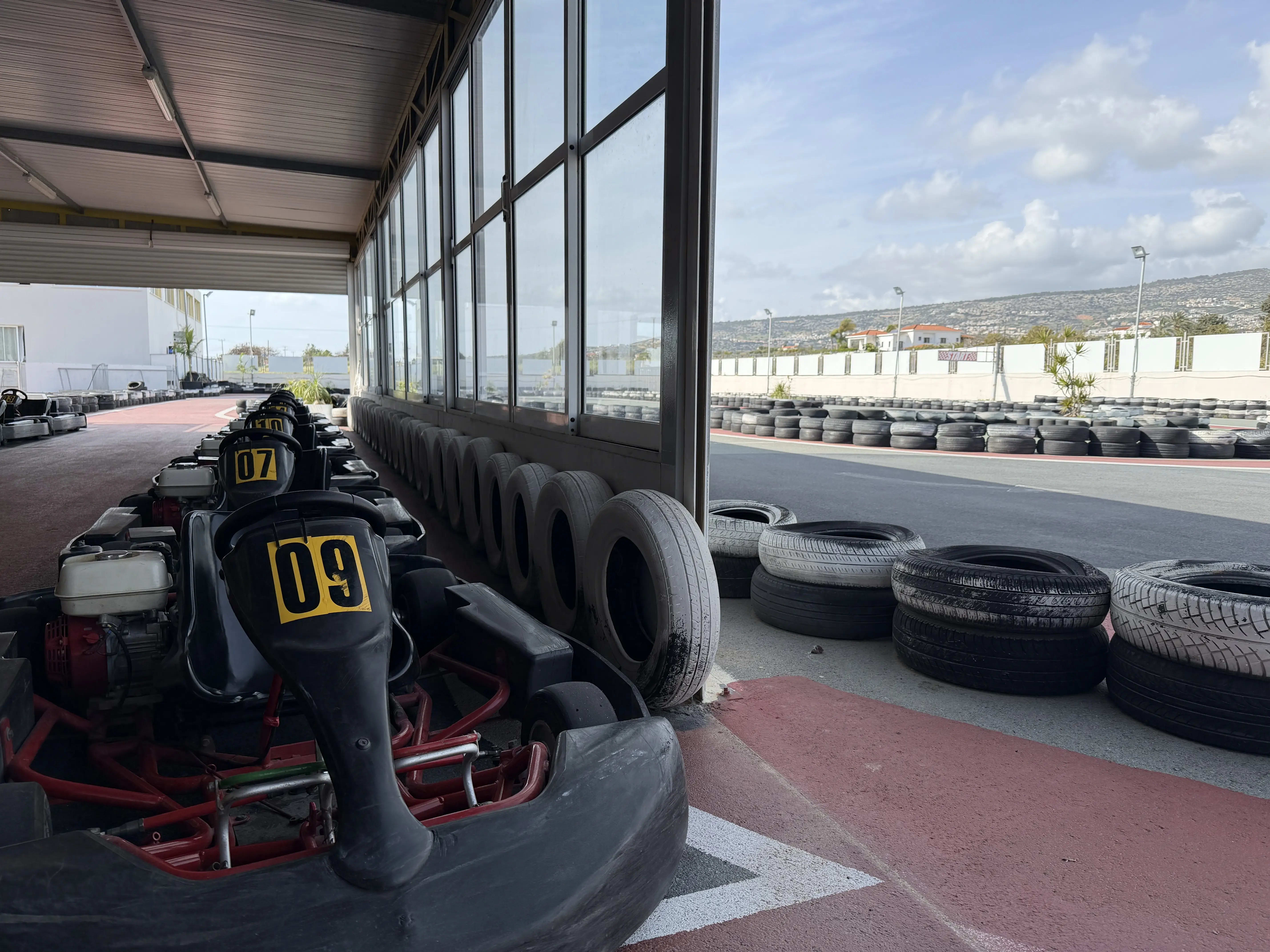 Kart track with go-karts in pit stop area