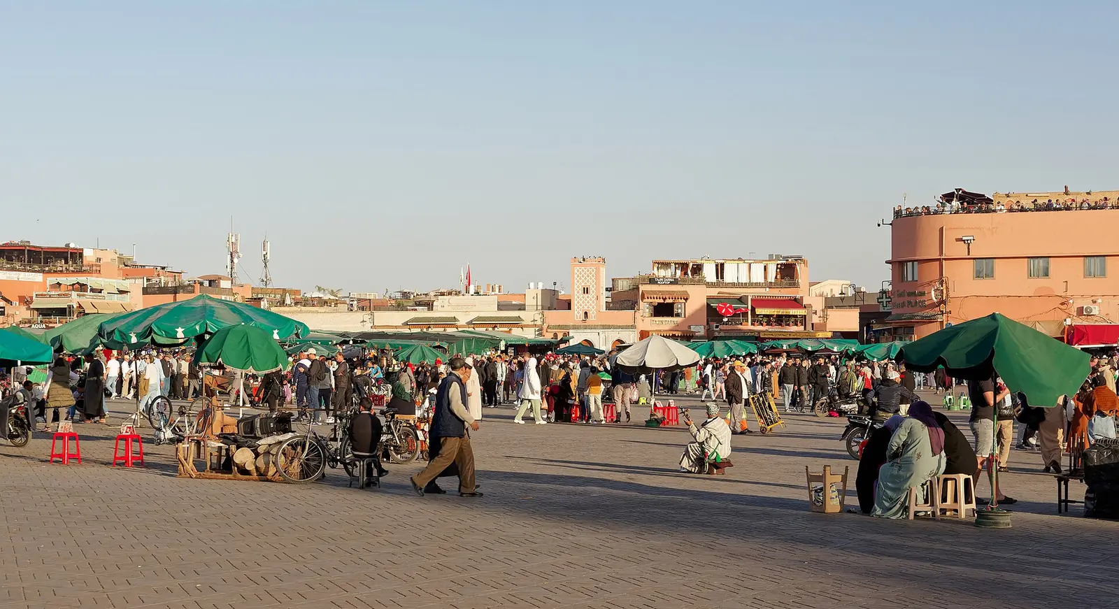 Stalls and visitors on Jemaa el-Fna square in Marrakech