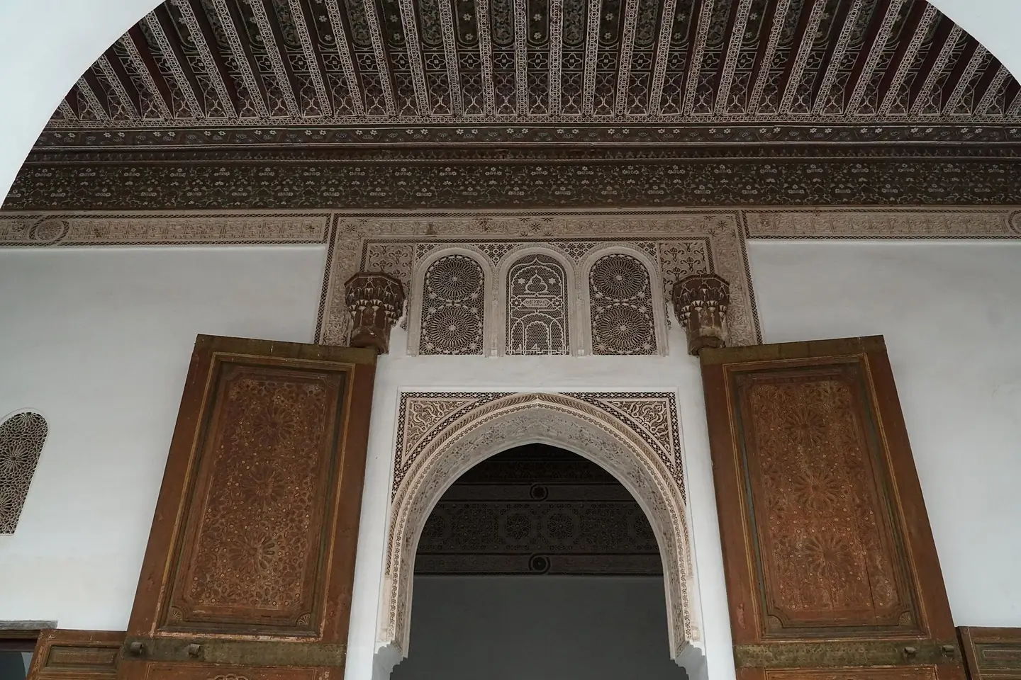 Carved wood and stucco above a doorway in the Bahia Palace