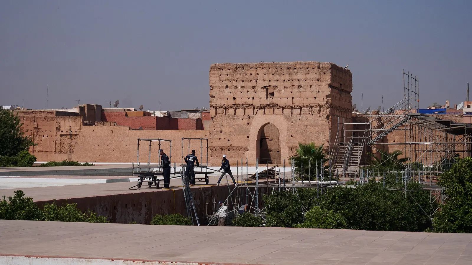 Visitors walking through the ruins of El Badi Palace