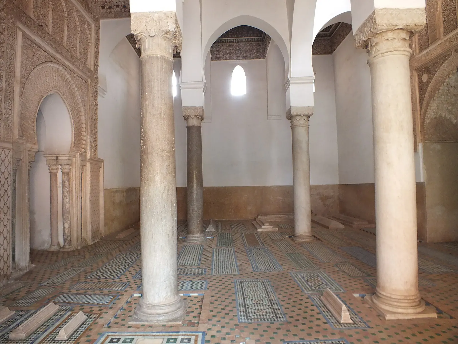 Marble columns and tombs inside a chamber of the Saadian Tombs in Marrakech
