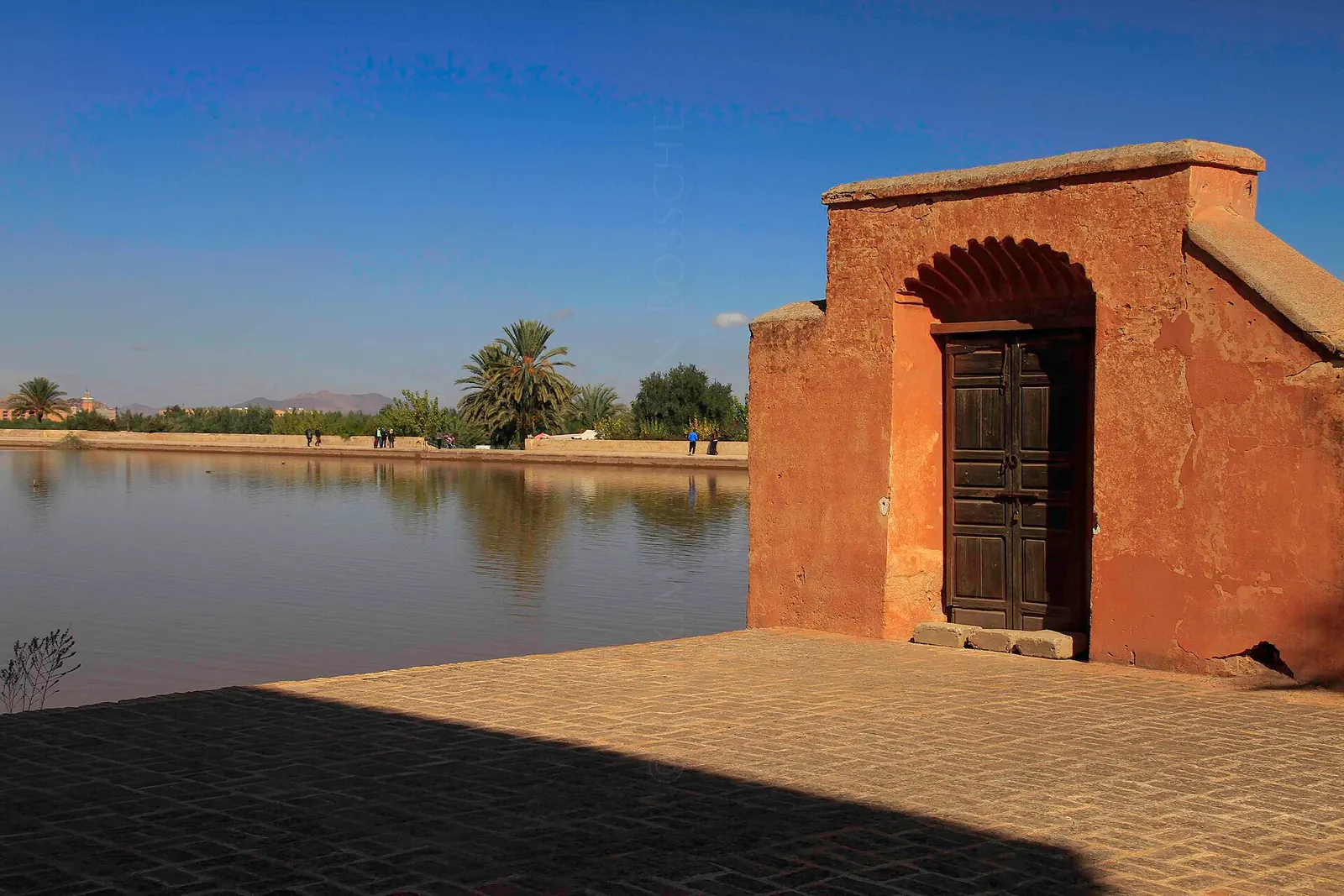 An arched opening in the Menara Gardens