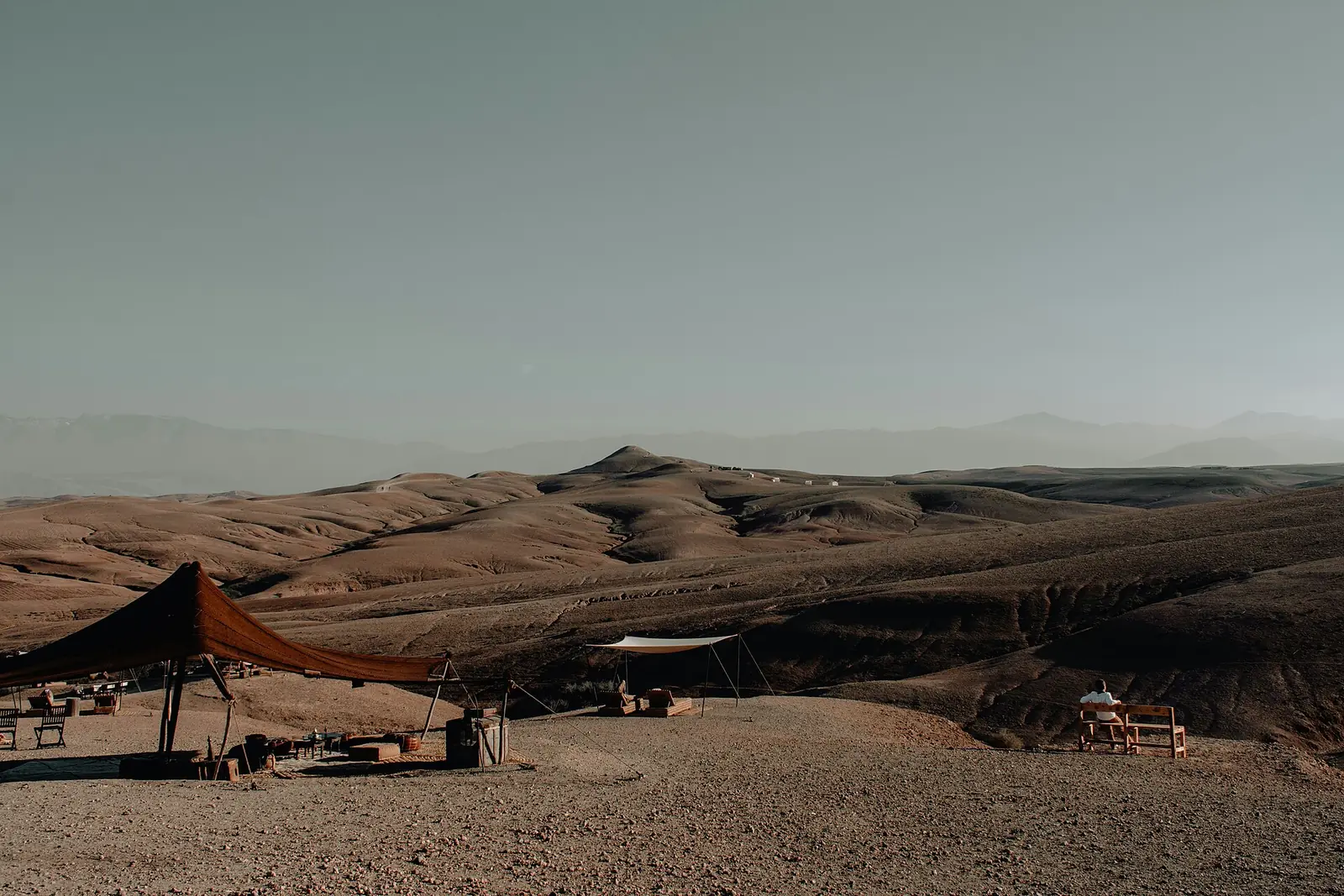 A shade shelter among the hills of the Agafay Desert