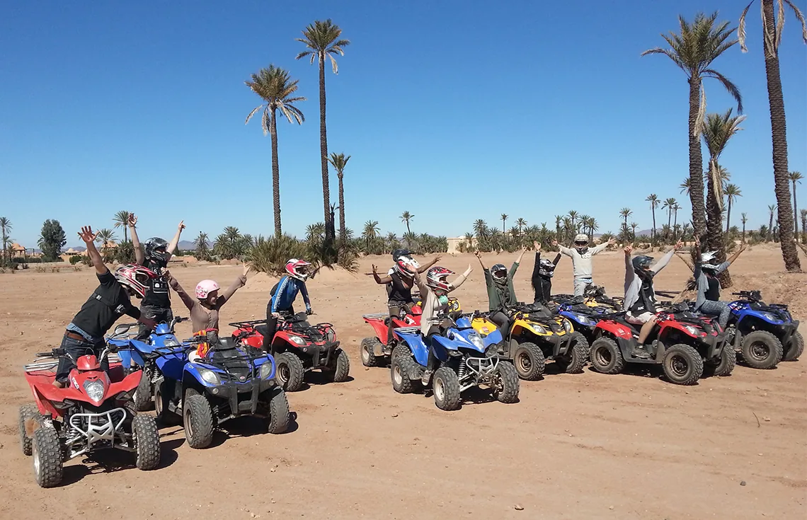 Quad bikes on a palm-grove track