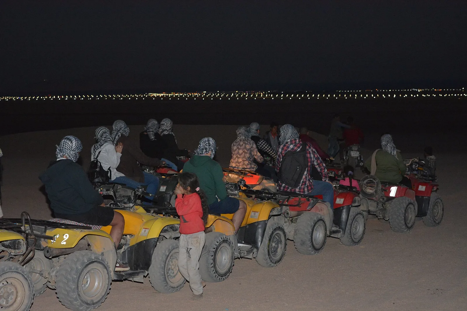 Group of quad riders on a desert safari