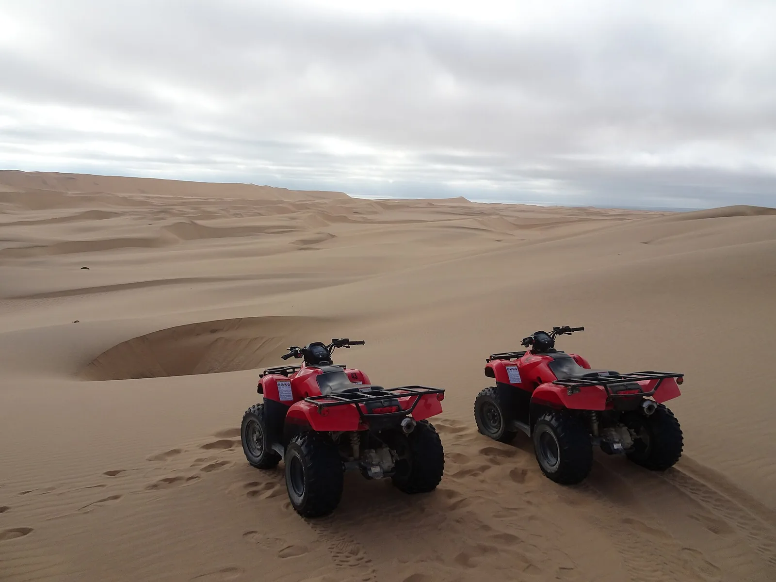Two quad bikes on sand dunes