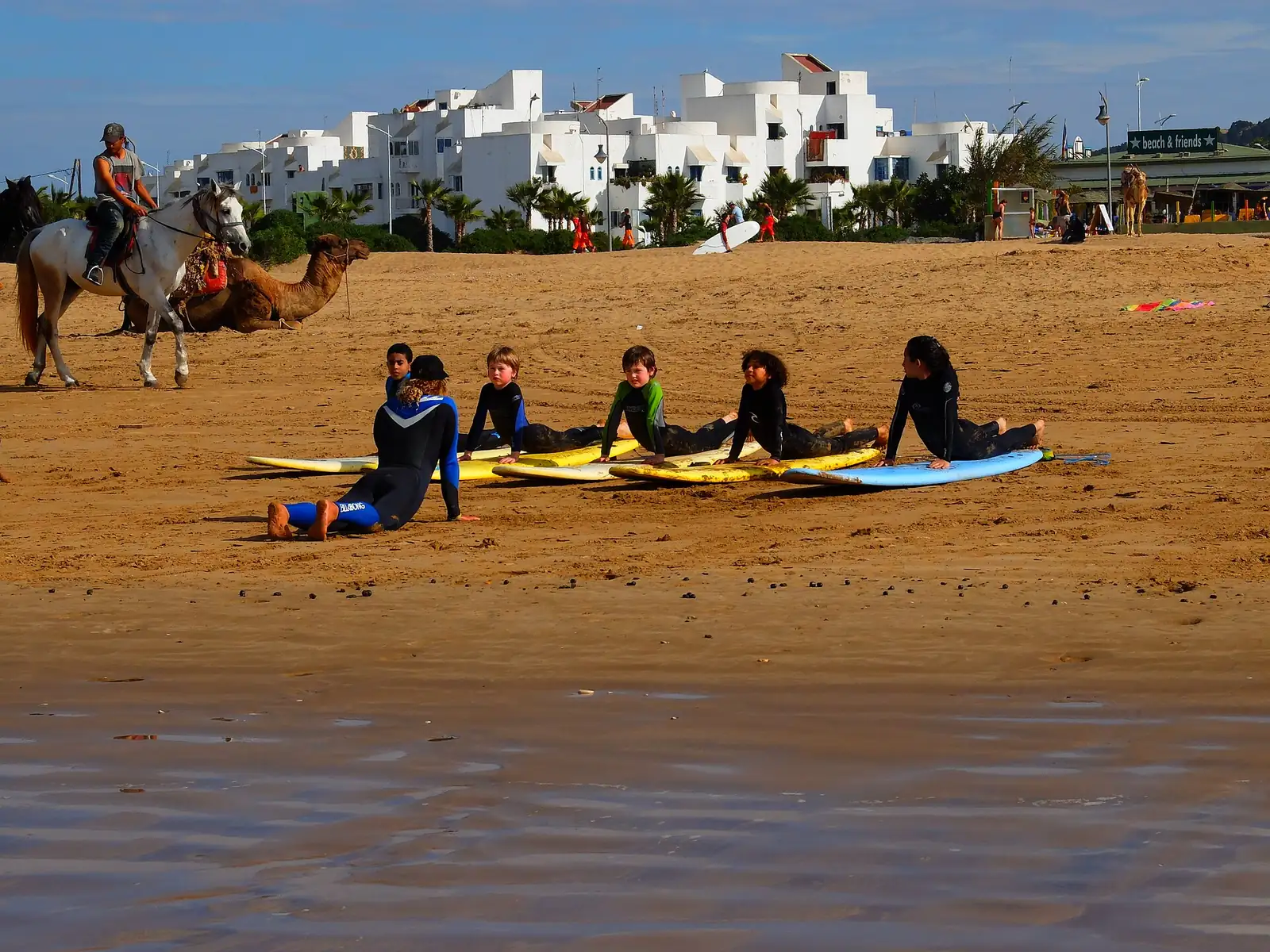 Beginner surf lesson on a Moroccan beach