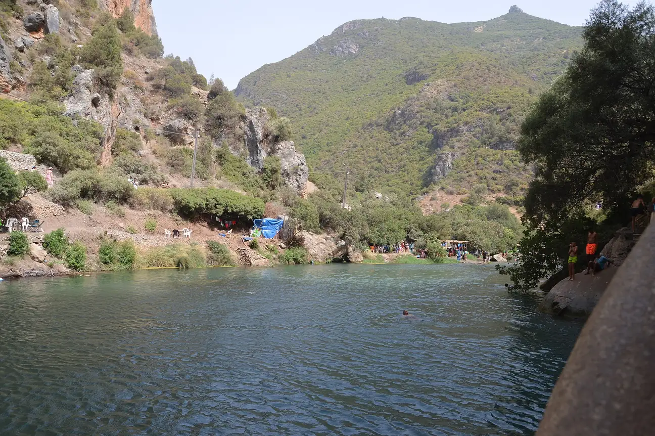 River pool among wooded hills at Akchour