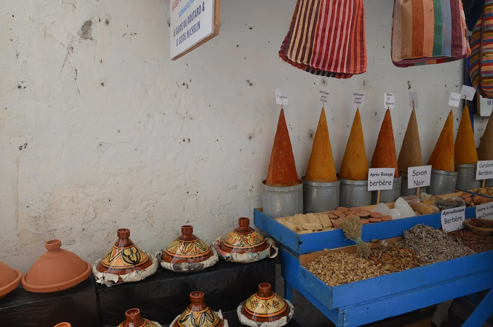 Cones of spices and small tagines at a stall in Essaouira