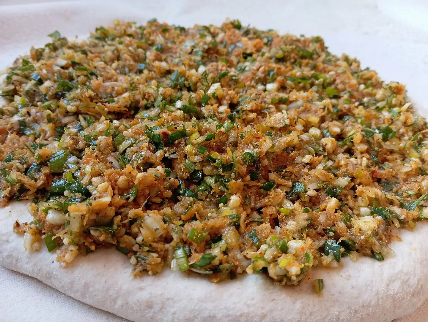 Chopped onion, herbs and spices prepared as madfouna filling