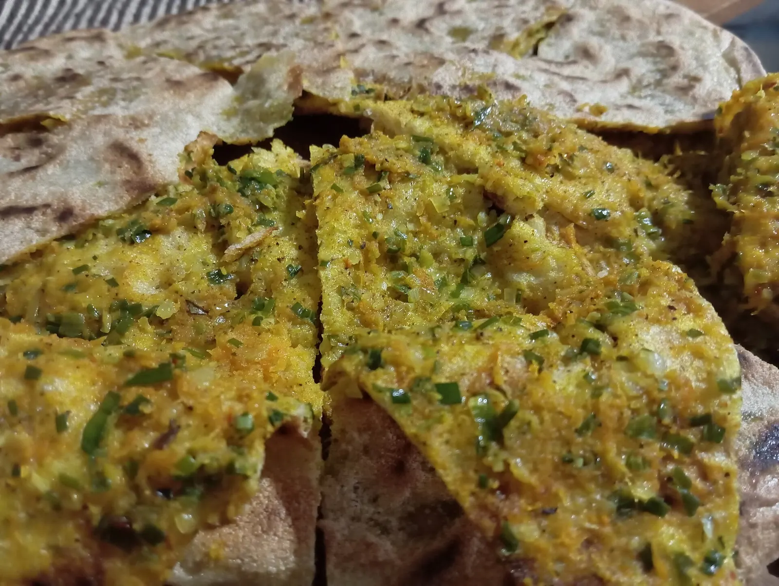 Slices of Berber stuffed bread showing the herb and meat filling