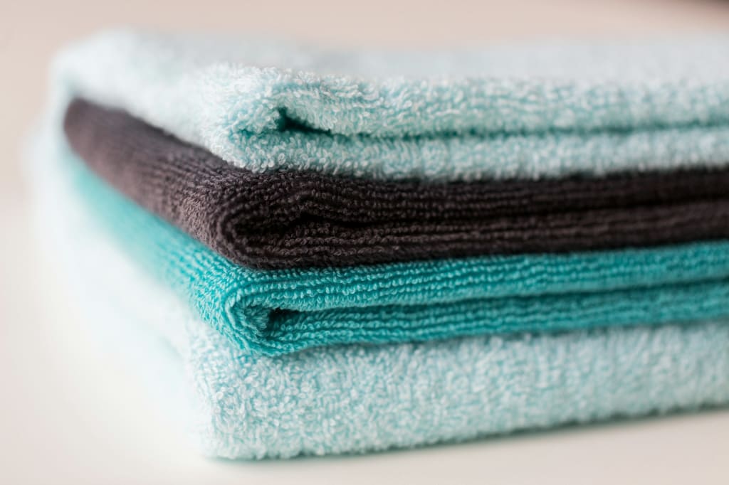 close up of stacked bath towels