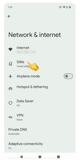 Network & internet screen with SIMs option highlighted for managing eSIM settings