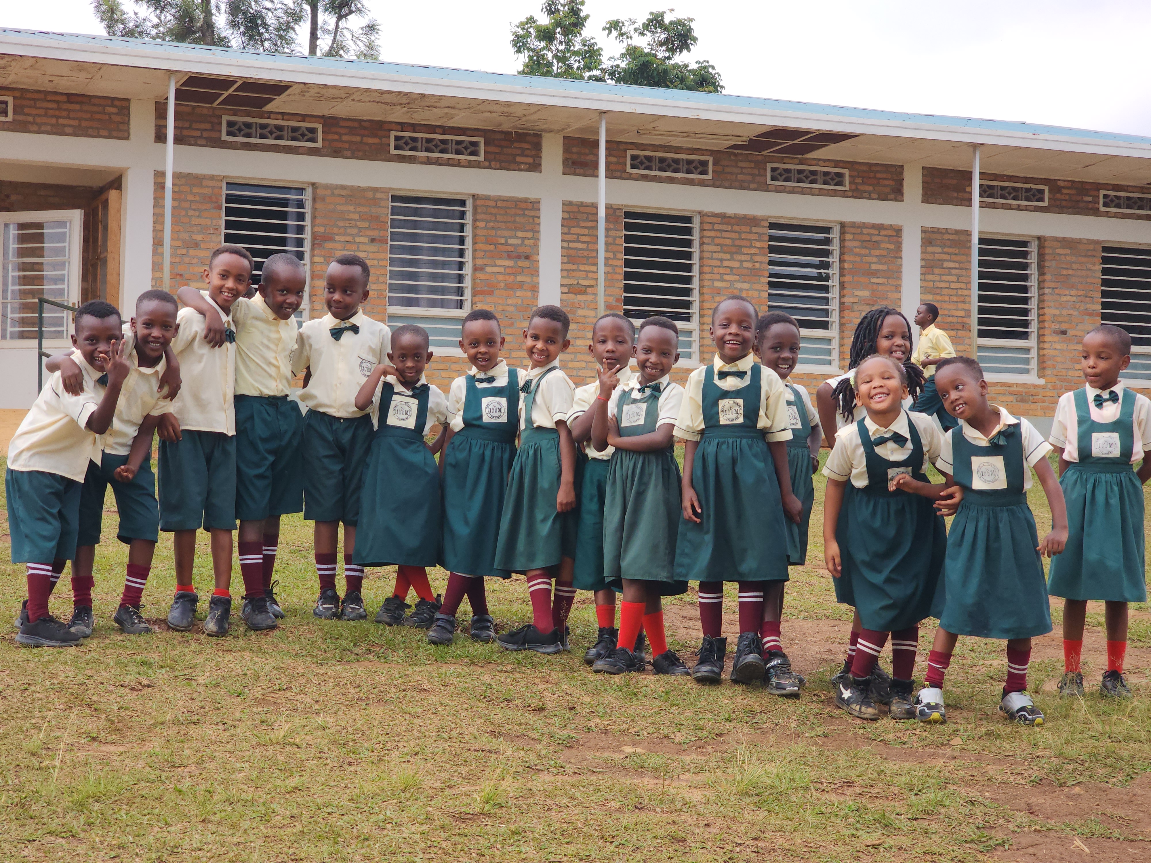 Children from Izere Mubyeyi community smiling together