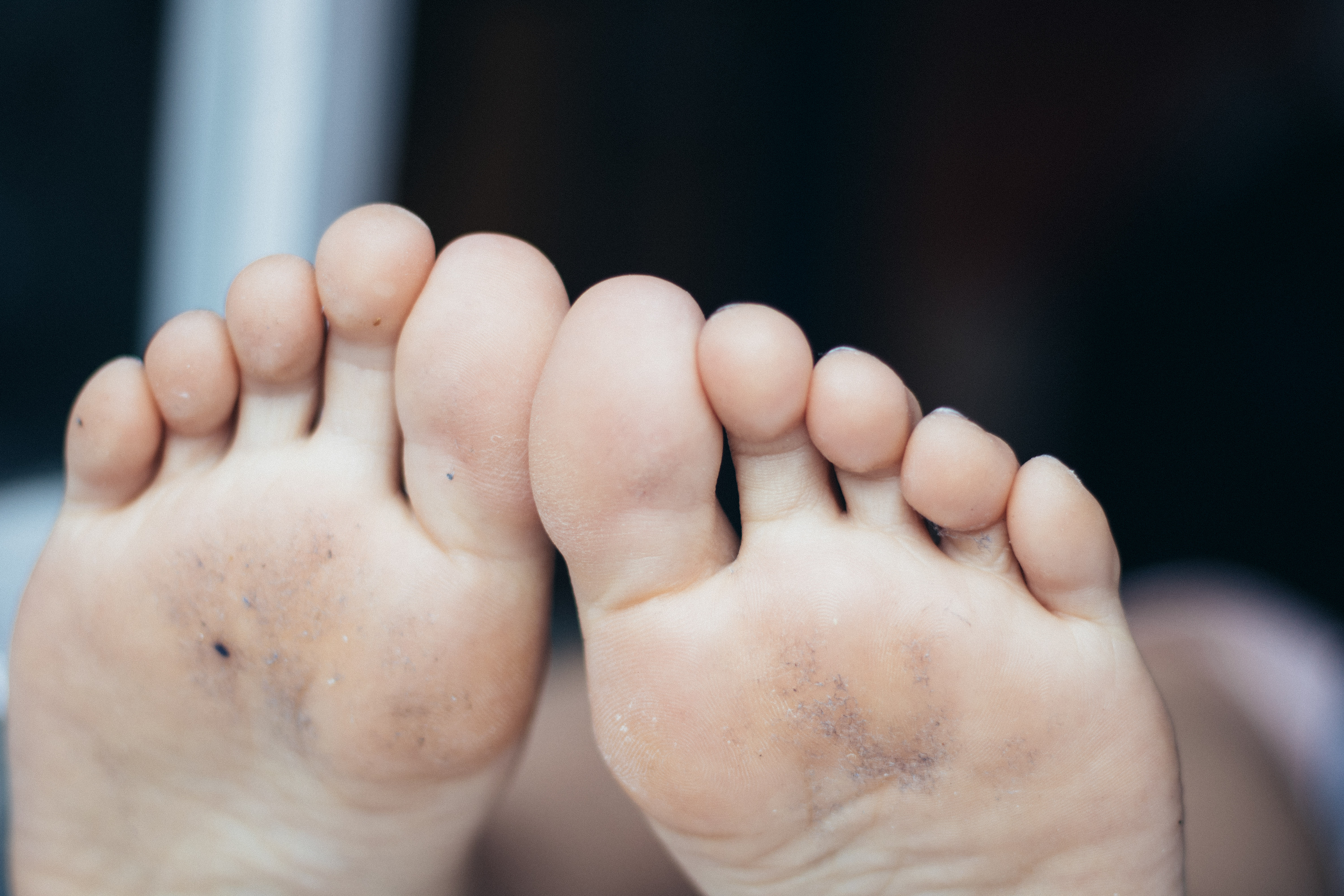 a woman's dusty soles resting on window sill and 