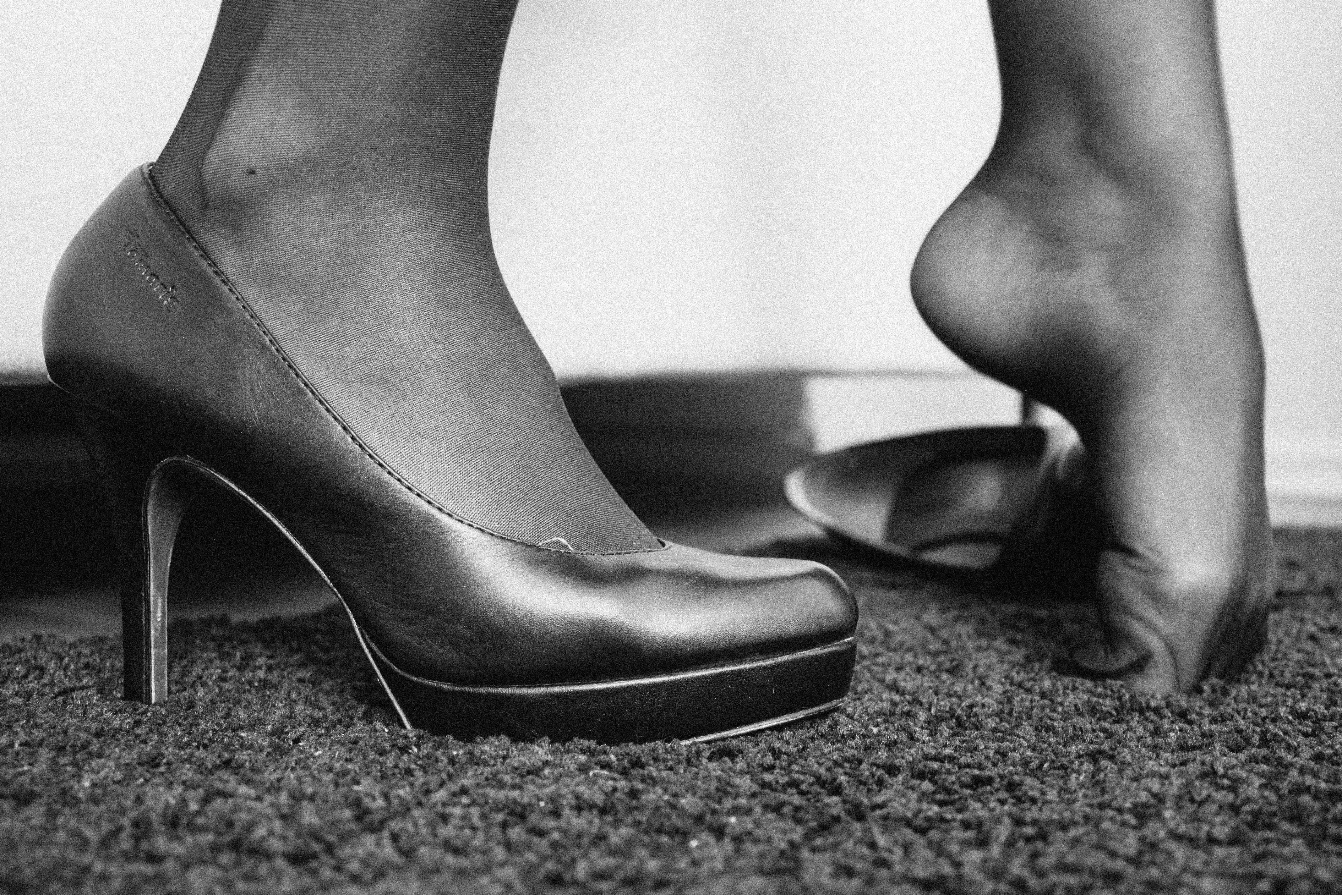 a woman in black nylons scrunching her toes into the floor