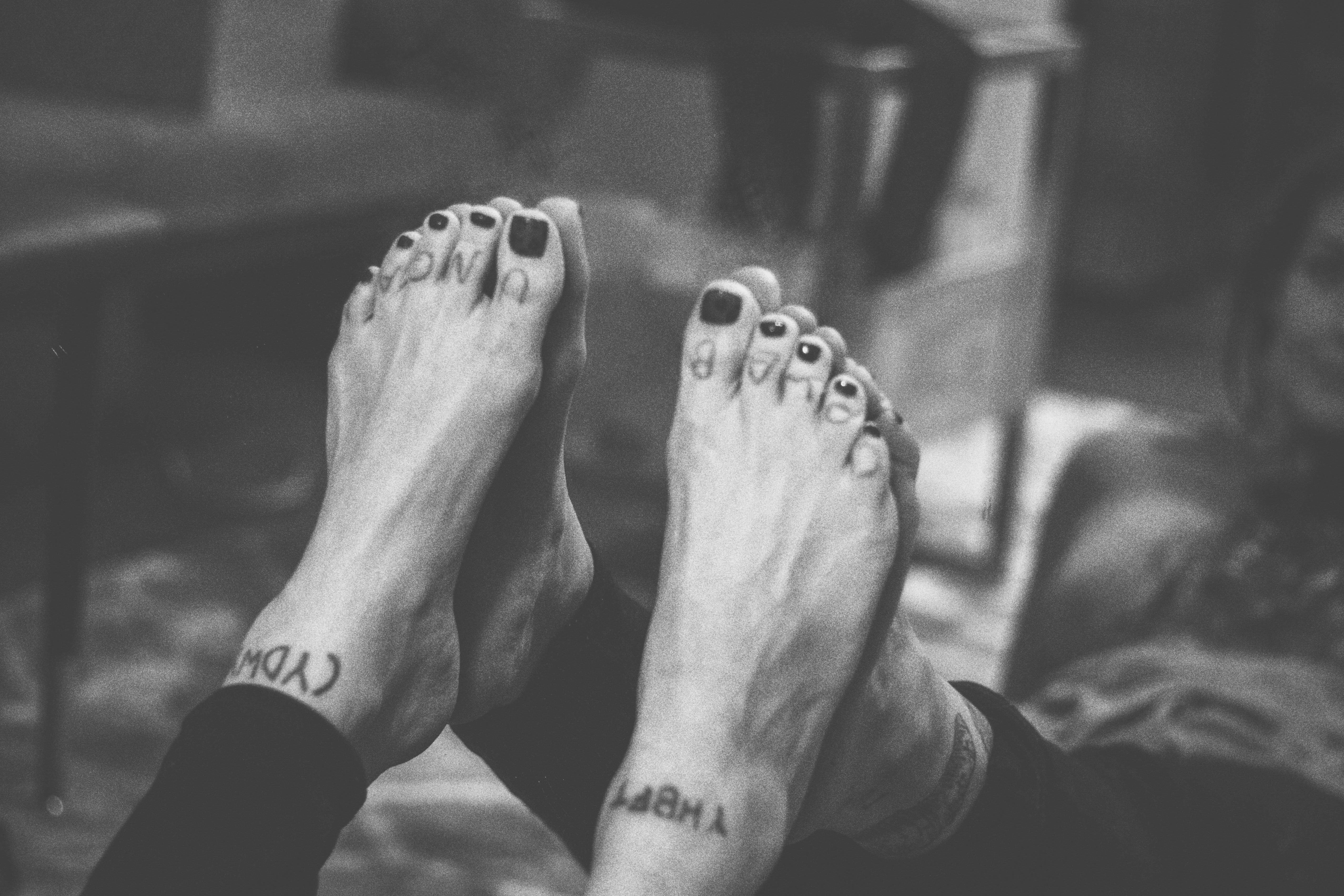a woman's feet pressed against a mirror