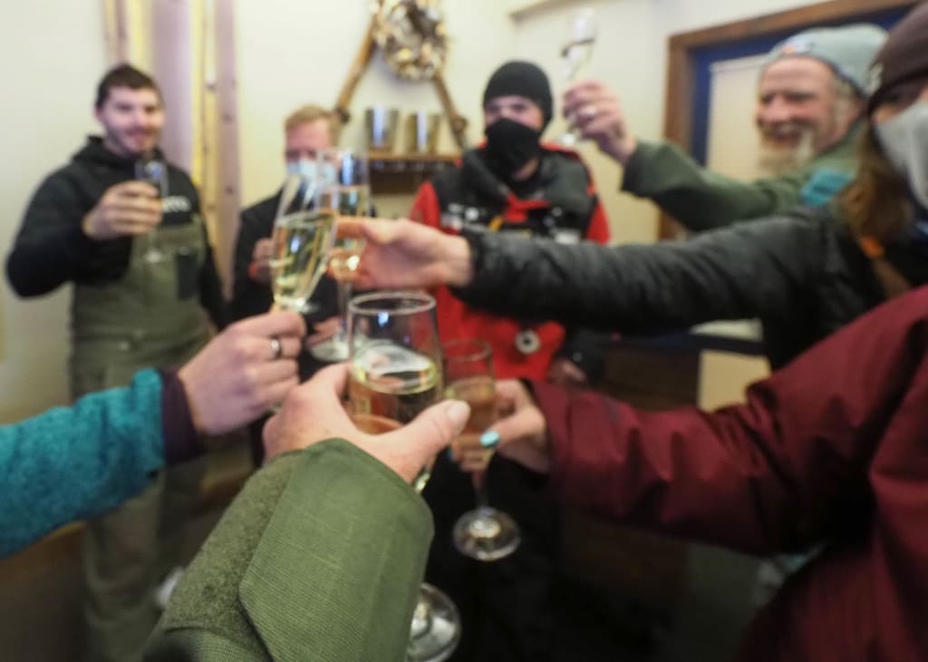 toasting after cat skiing at Keystone