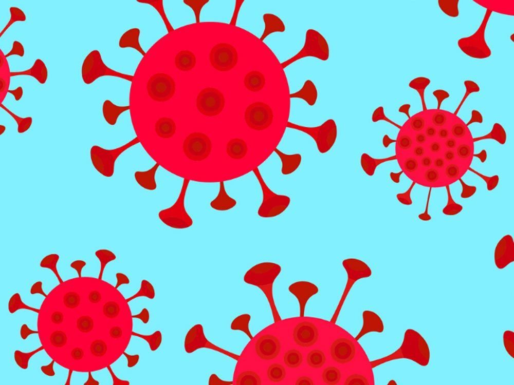 Red SARS-CoV-2 virus particles scattered across a light blue background.