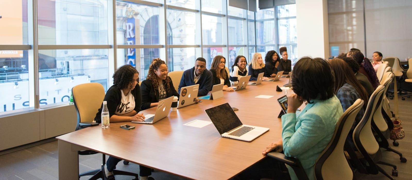 Business professionals meeting around a boardroom table
