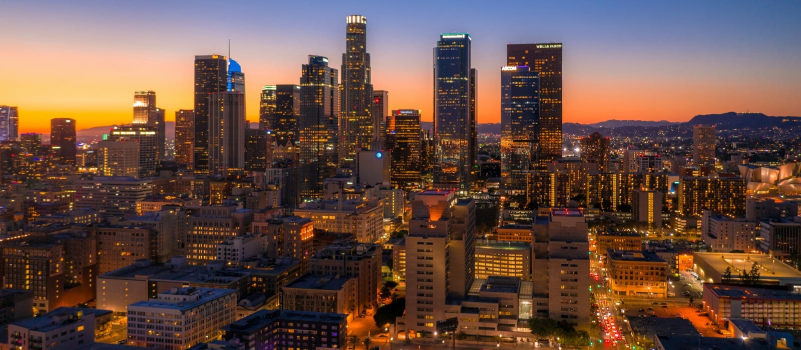 City skyline at night, representing investment residency and citizenship