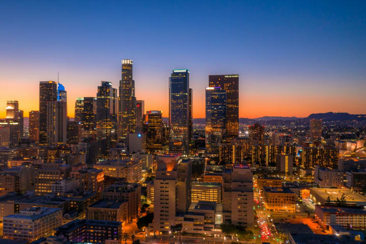 City skyline at dusk representing investment residency and citizenship