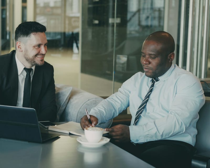 Immigration adviser discussing a client’s plans during a consultation meeting