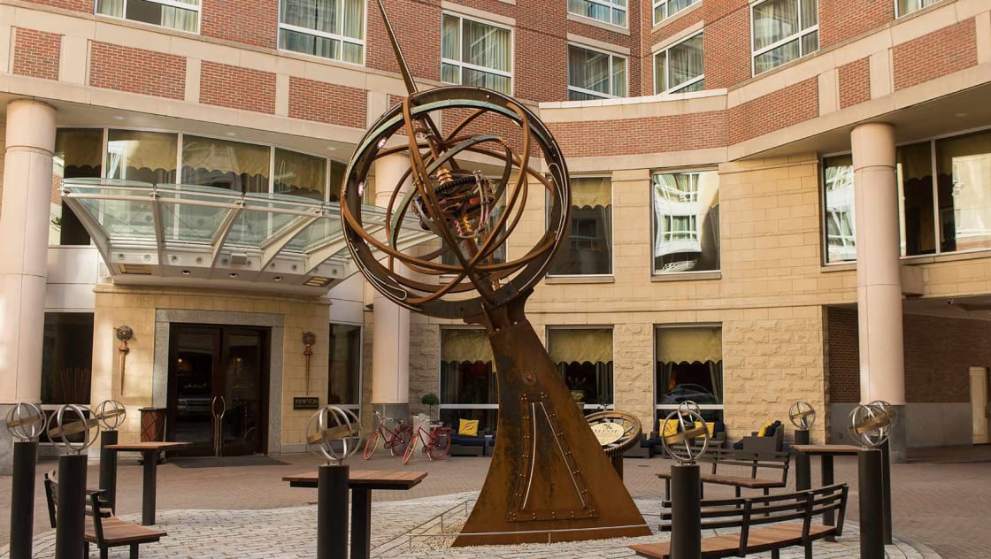 Kimpton Marlowe Hotel courtyard with sphere shaped, metal art fixture, Celeste, in the middle