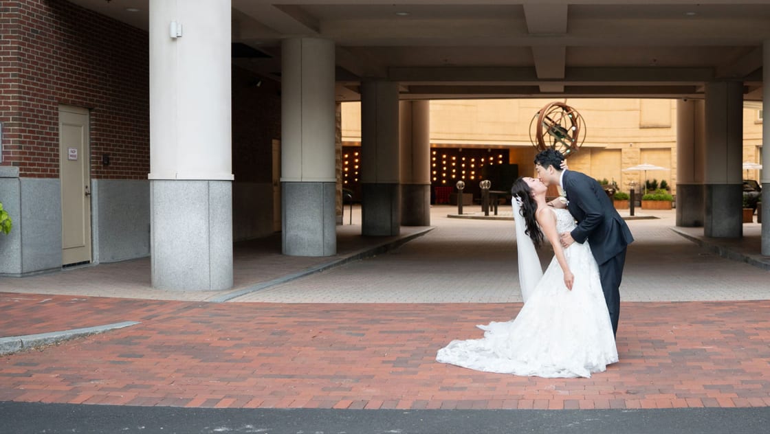 wedding couple in front of kimpton marlowe entrance