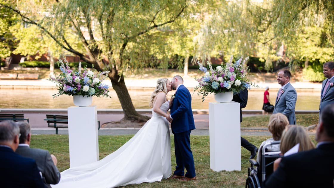 bride and groom kissing at the altar