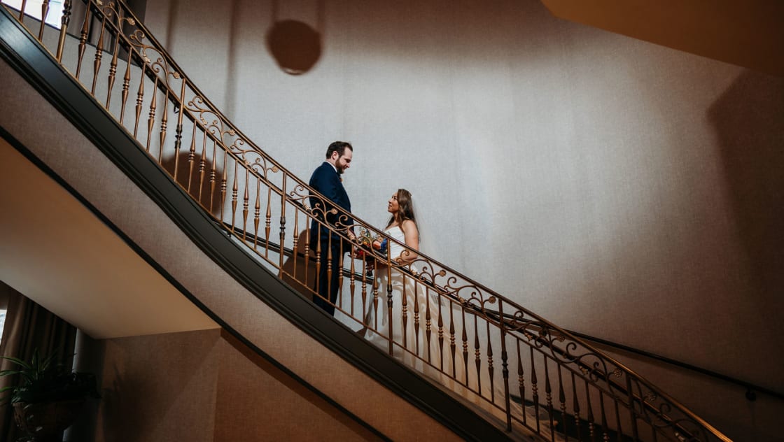 bride and groom on staircase