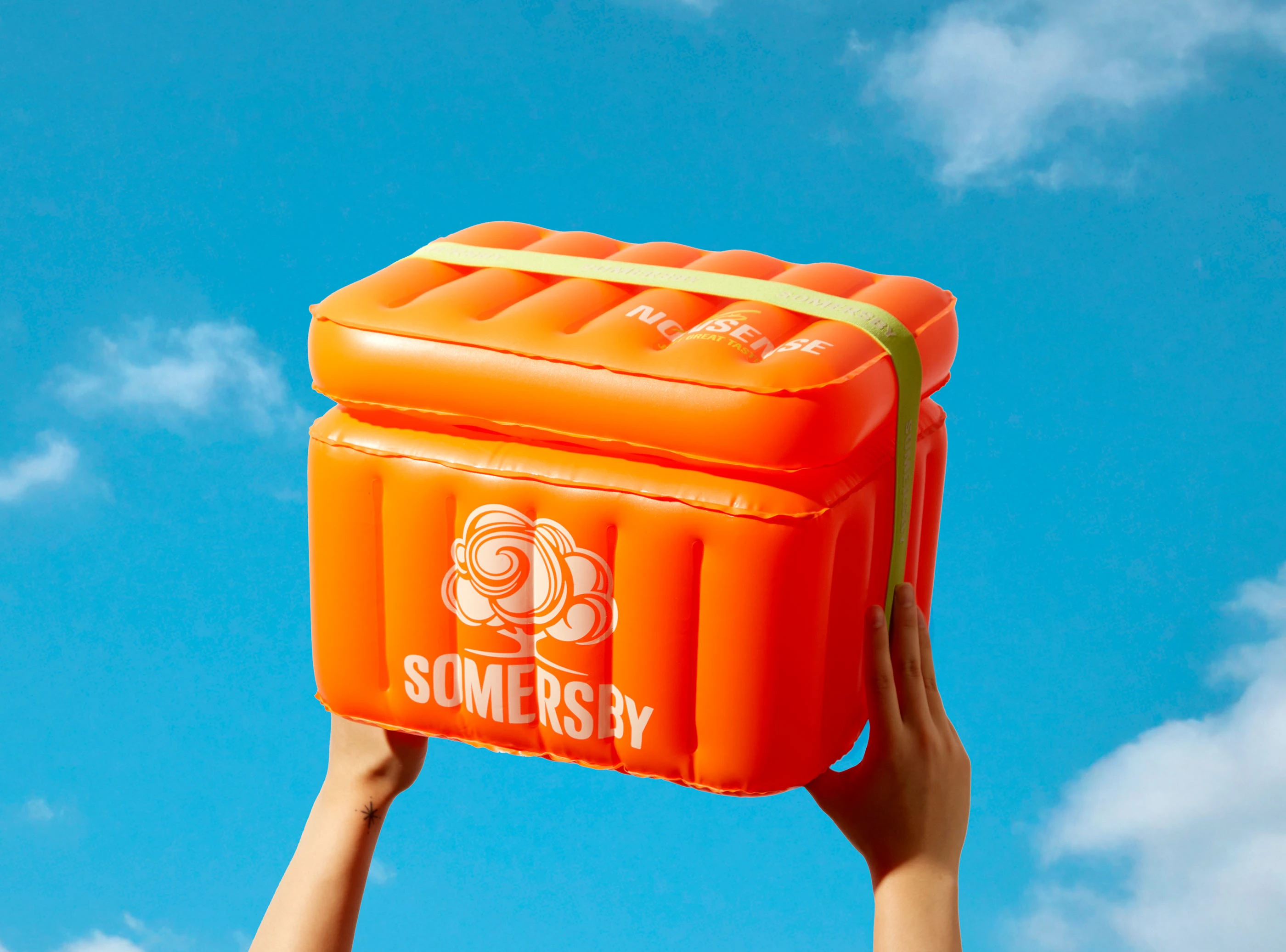 Branded mint notebook and matching pen with clean studio styling