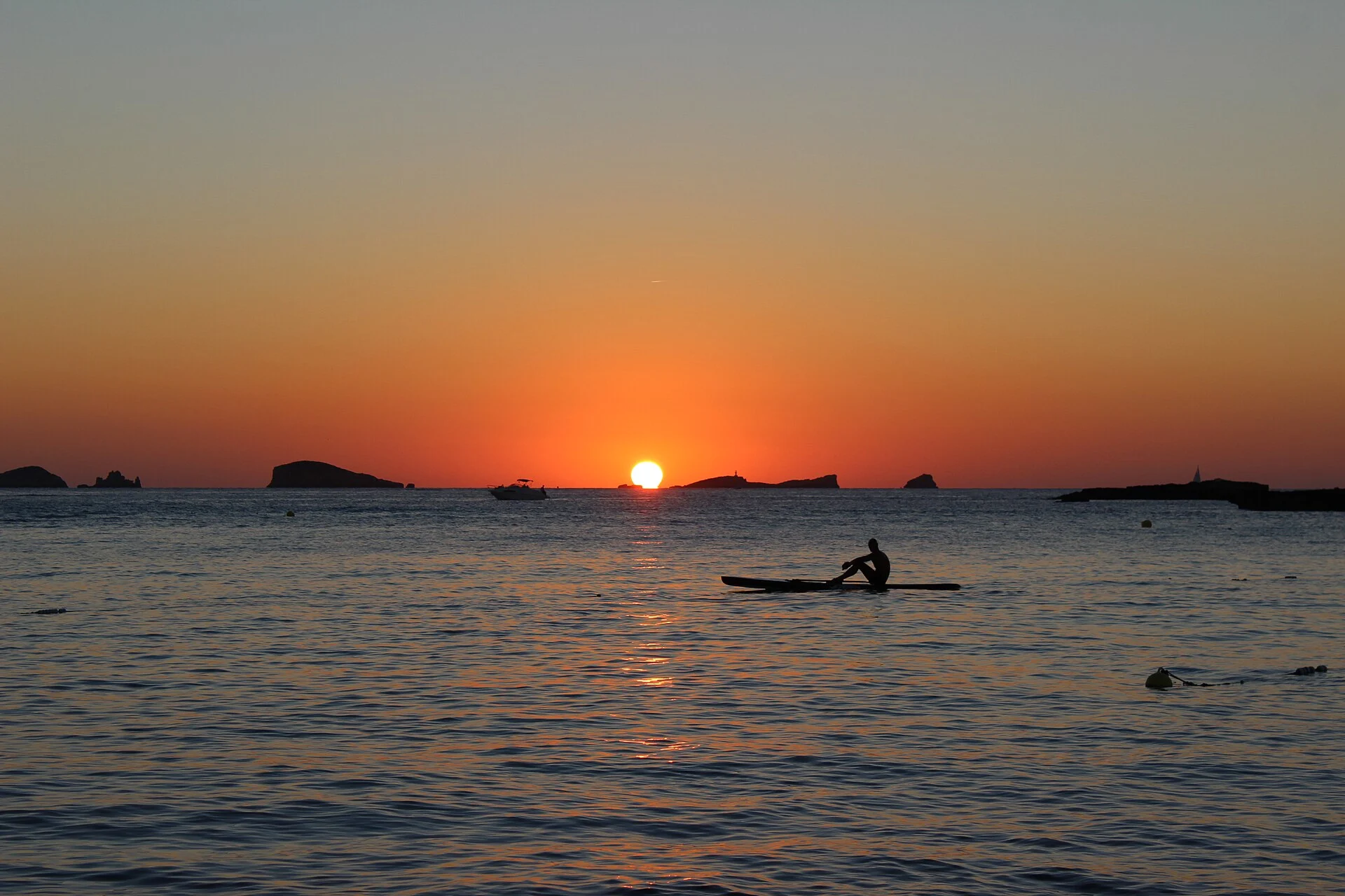 Ibiza coastline at sunset over the Mediterranean, viewed from Cala Comte