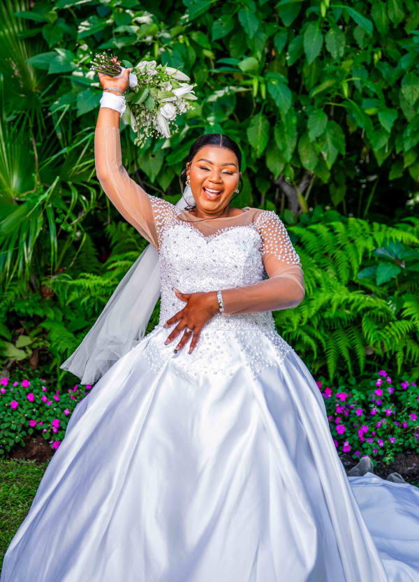 Makoti raising her hand as the official wife