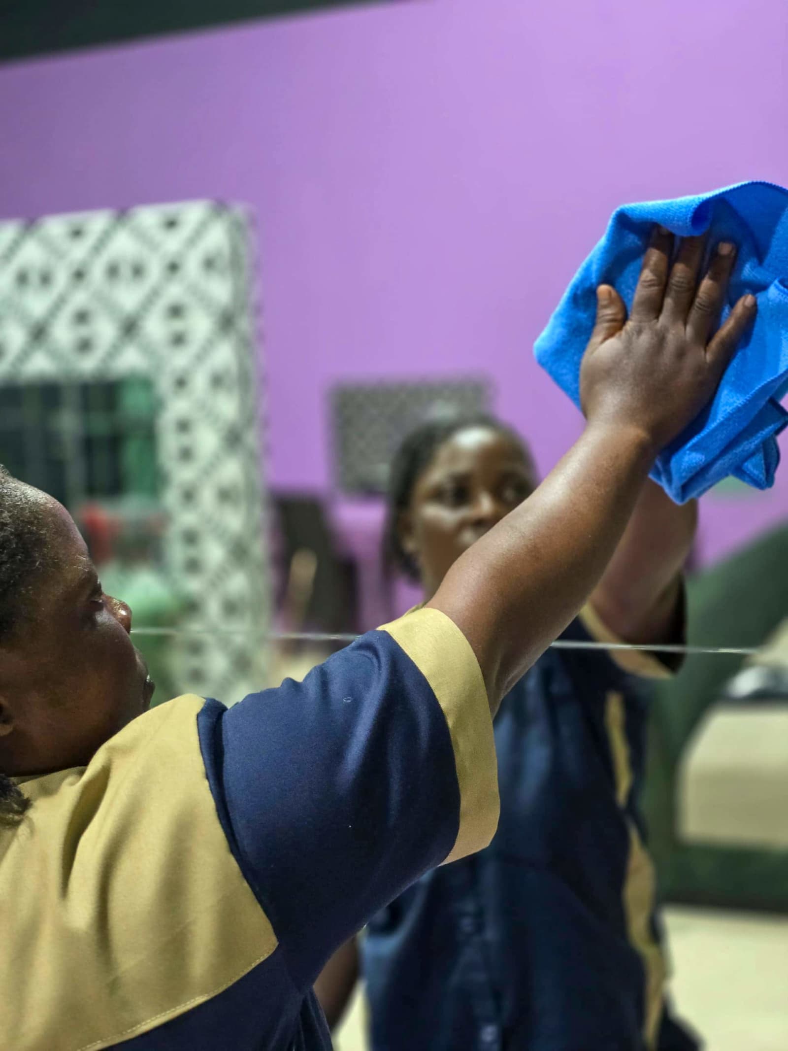 Safisha professionals maintaining a spotless workspace for a business client.