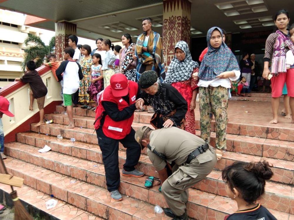 The Palang Merah Indonesia (“PMI” - Indonesian Red Cross) has been on the frontline of search and rescue efforts, providing emergency disaster relief. Image: Singapore Red Cross