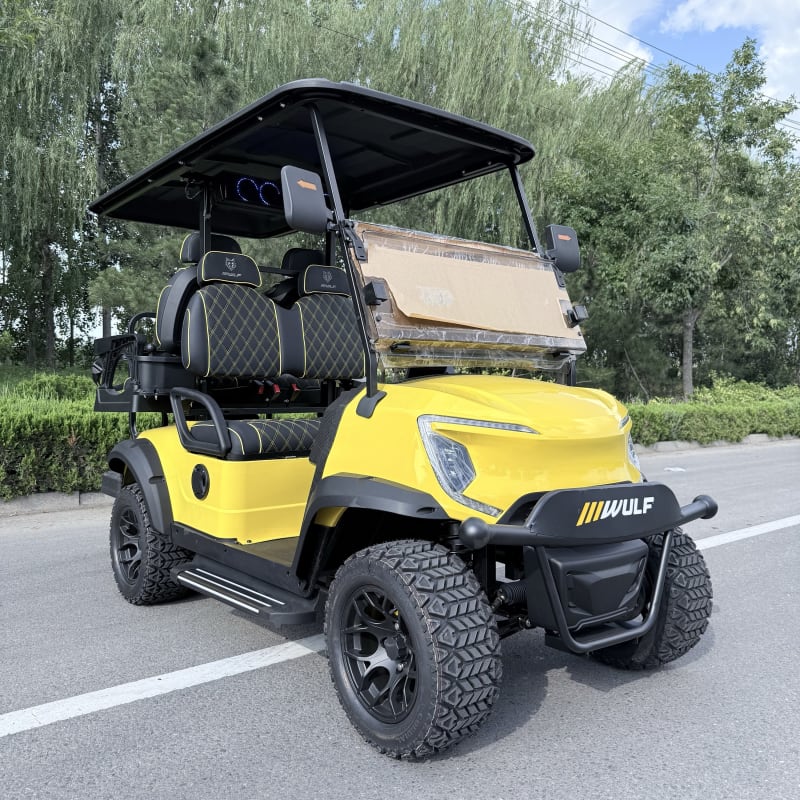 Yellow Wulf golf cart photographed from the front three-quarter angle