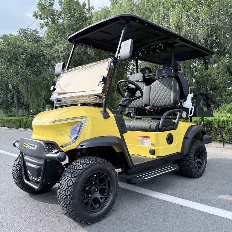 Yellow Wulf golf cart from the near-side front three-quarter angle