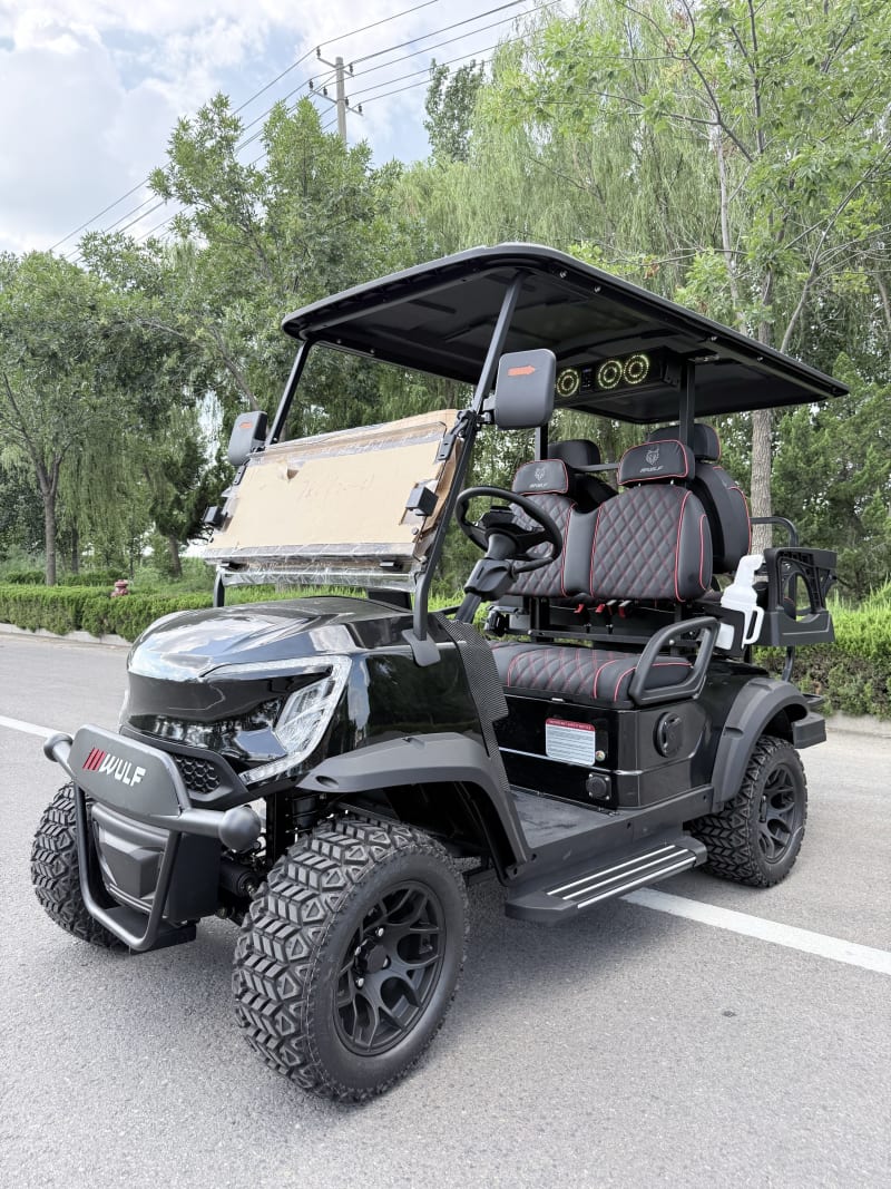 Black Wulf golf cart from the near-side front three-quarter angle