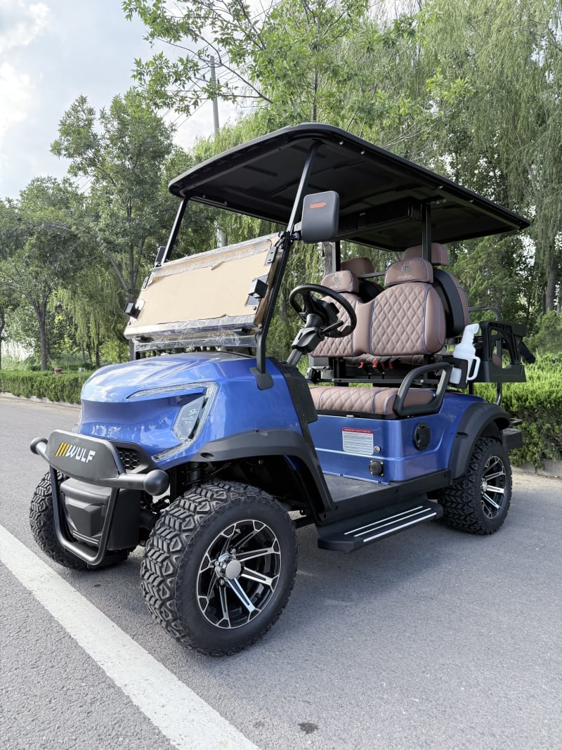 Blue Wulf golf cart with cognac interior from the near-side front angle