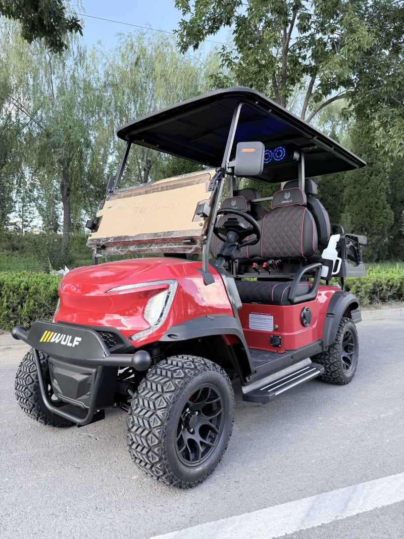 Red Wulf golf cart from the near-side front three-quarter angle