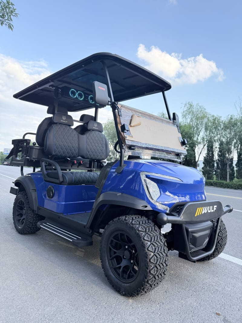 Blue Wulf golf cart with black diamond-stitched interior, front three-quarter angle