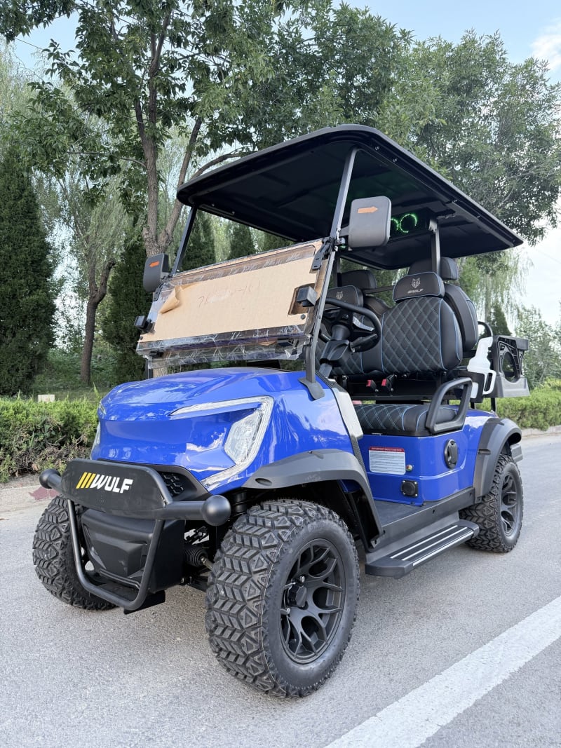 Blue Wulf golf cart from the near-side front three-quarter angle