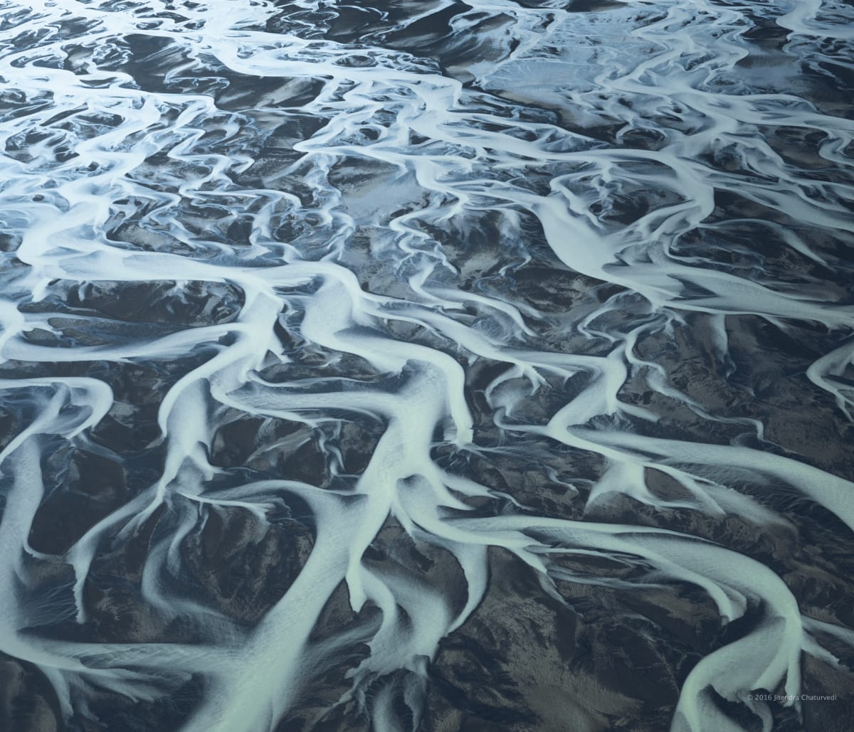 Photograph: aerial river delta mineral veins