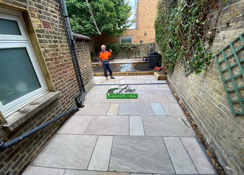 Sandstone patio and raised garden levels in Brixton