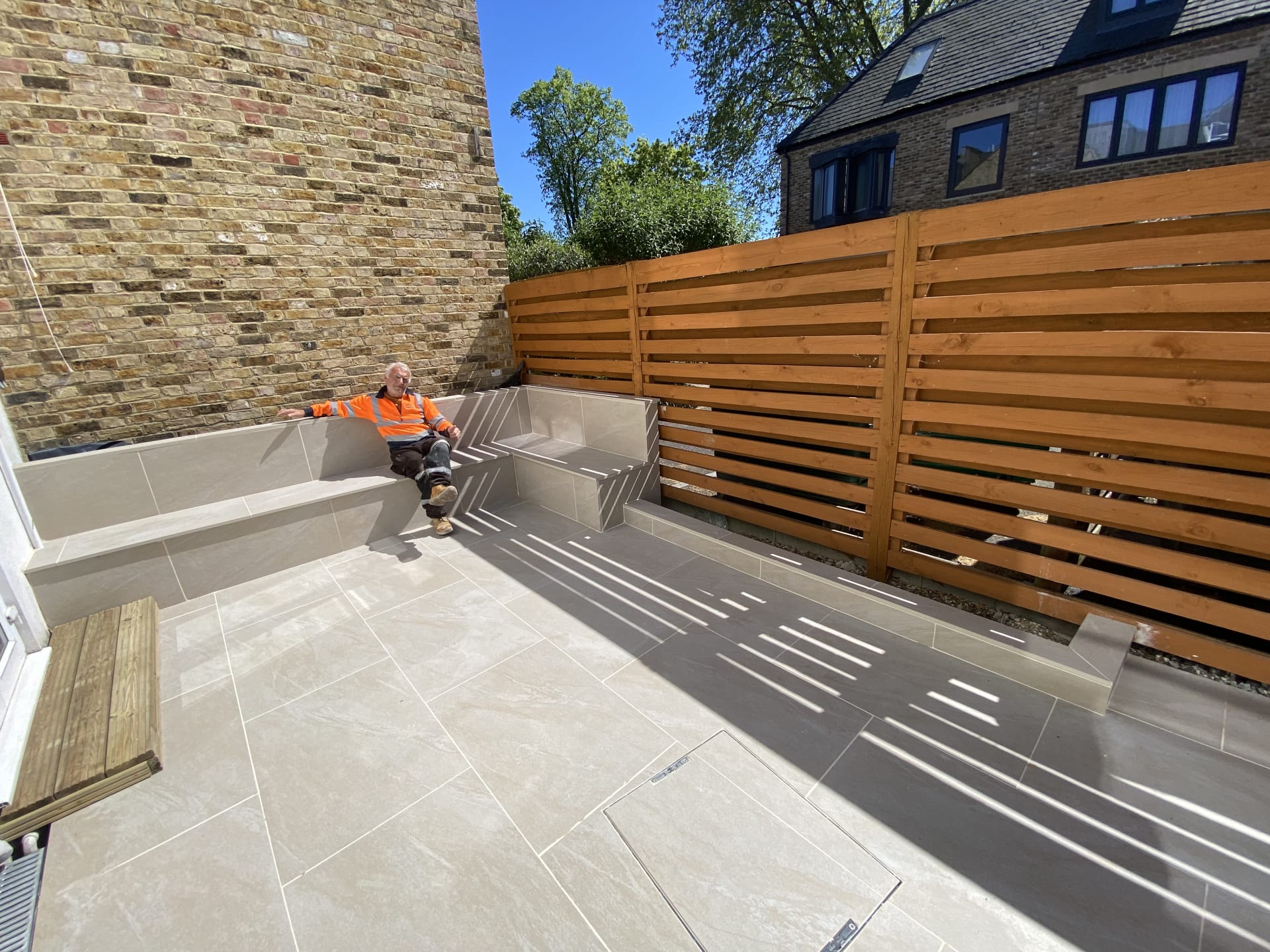 Garden after patio and bench transformation Wimbledon