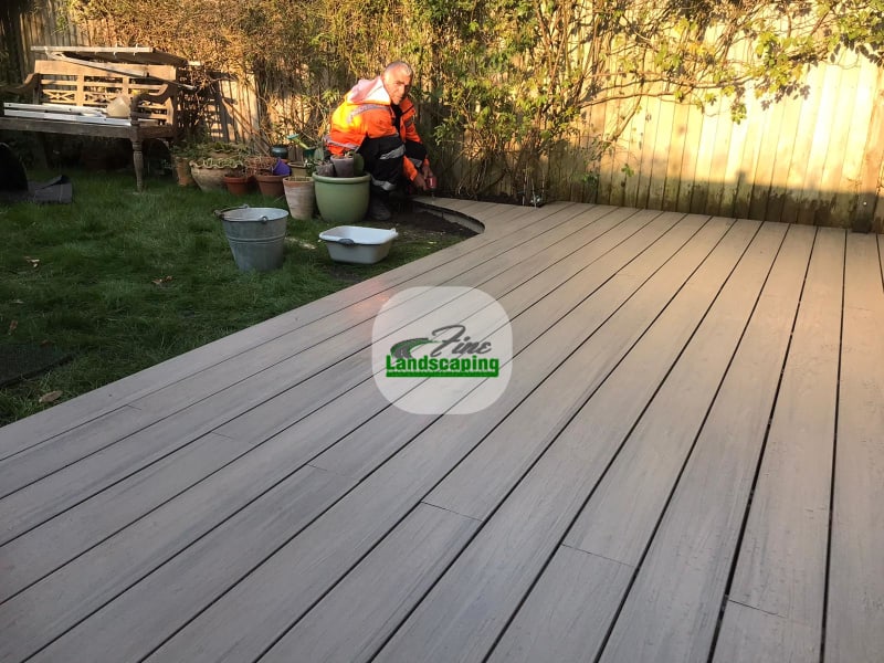 Grey deck boards following a curved garden edge