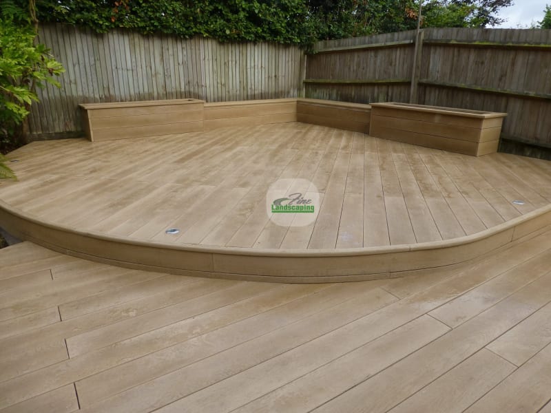Curved decking with a broad step and built-in timber bench